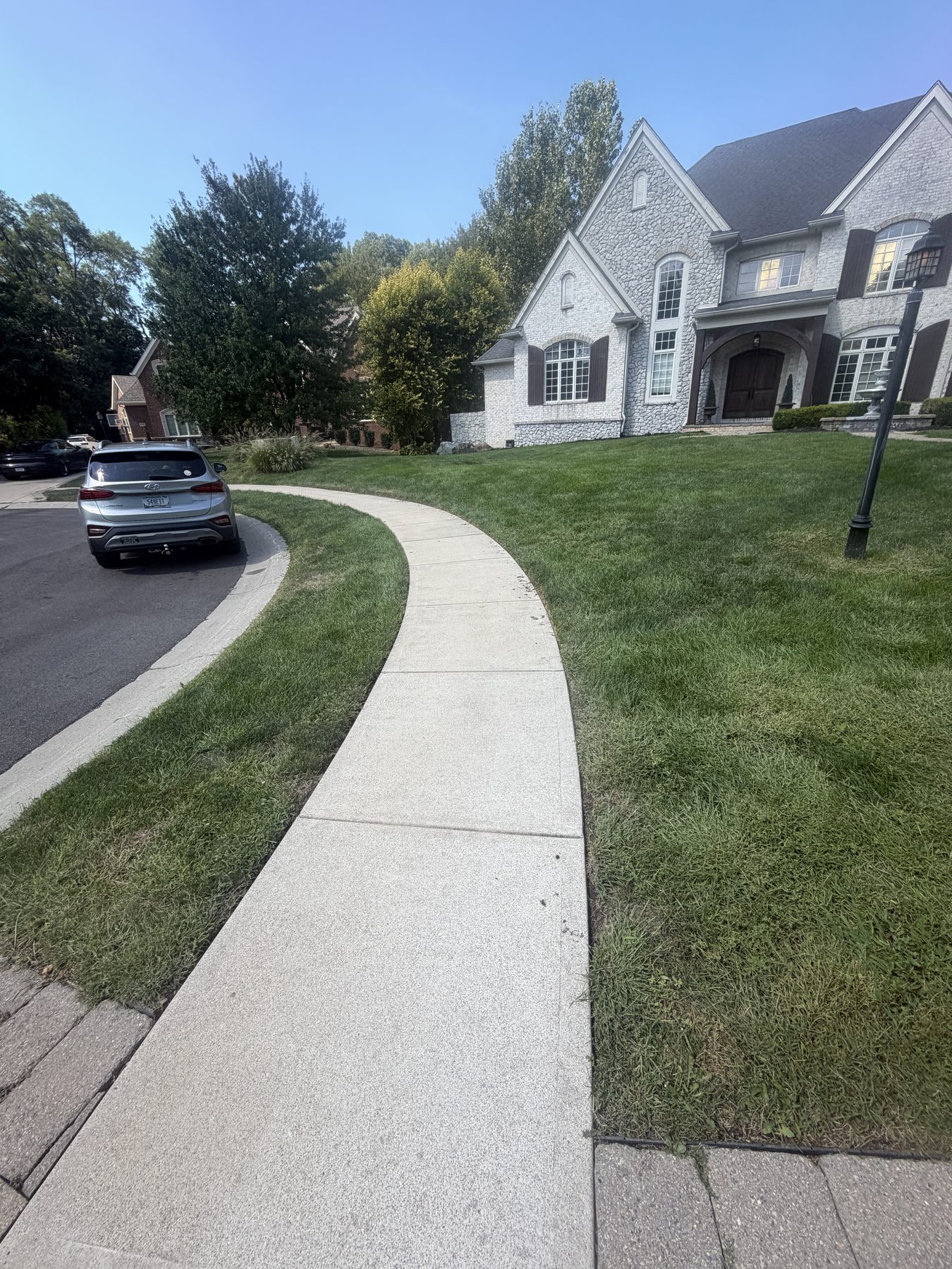 After professional sidewalk and walkway pressure washing